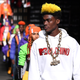 A model walks the runway during the Moschino x H&M - Runway at Pier 36 on October 24, 2018 in New York City.